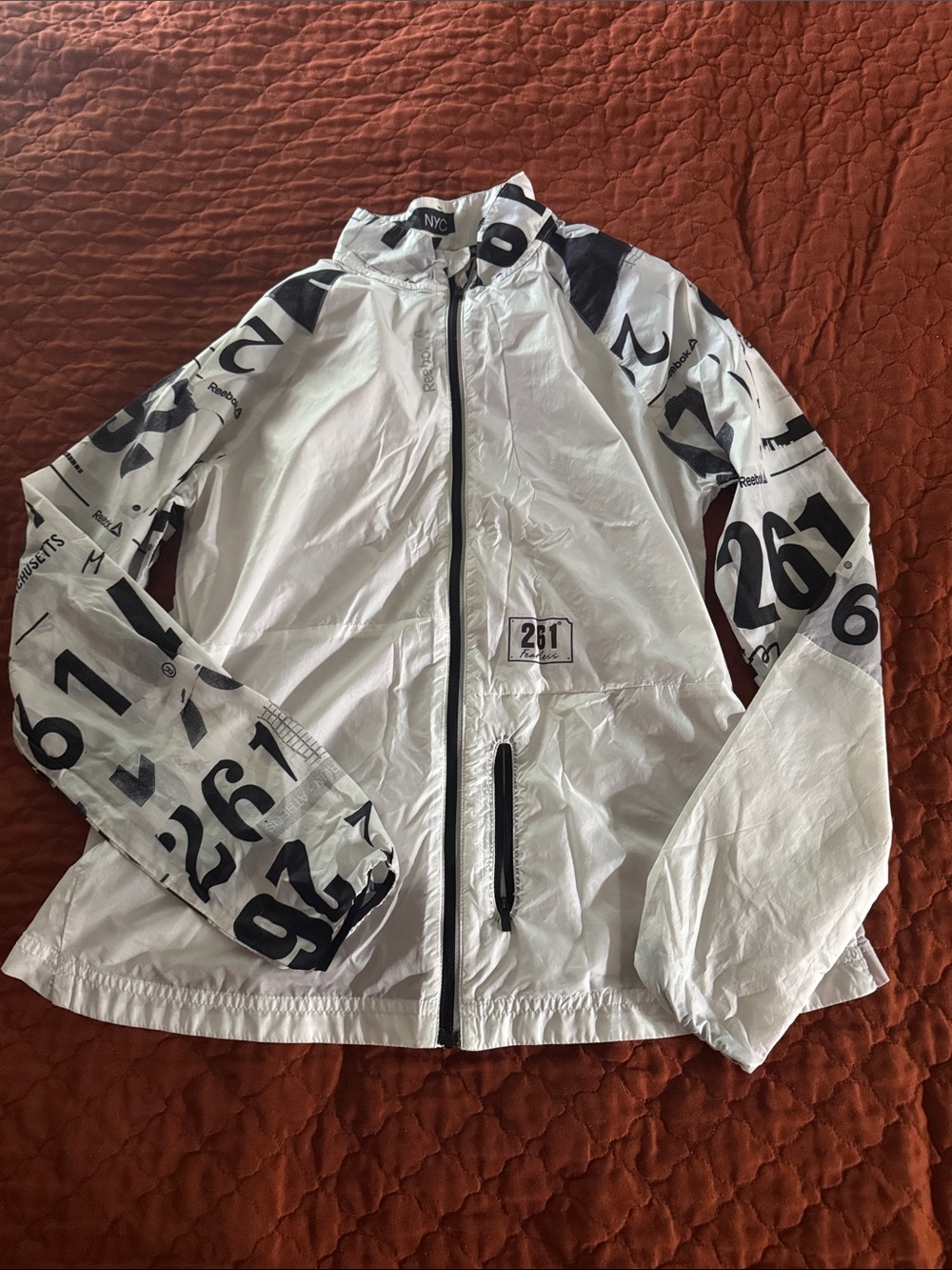 Reebok White Hooded Windbreaker with Black Graphic Accents